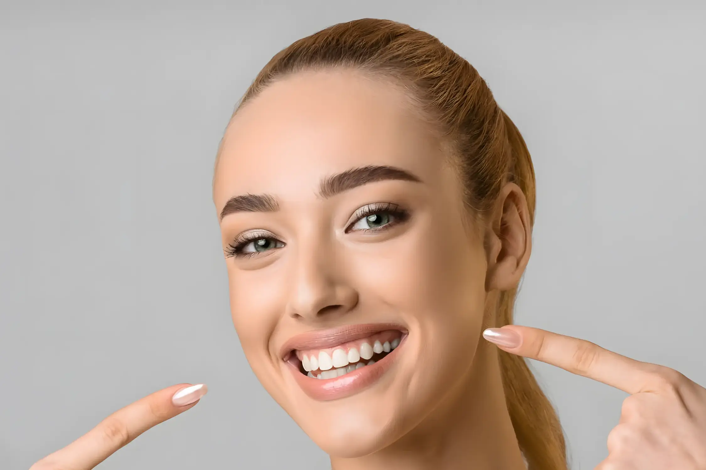 Confident Smiles Start with Daily Oral Care from Grin Teeth A woman proudly showing her healthy smile, reflecting Grin Teeth’s vision to help people build confidence through simple, science-backed oral care routines.