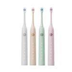 Grin Teeth ET 3 minimalist electric toothbrushes in white, beige, green, and pink shown side by side to present color variety and style