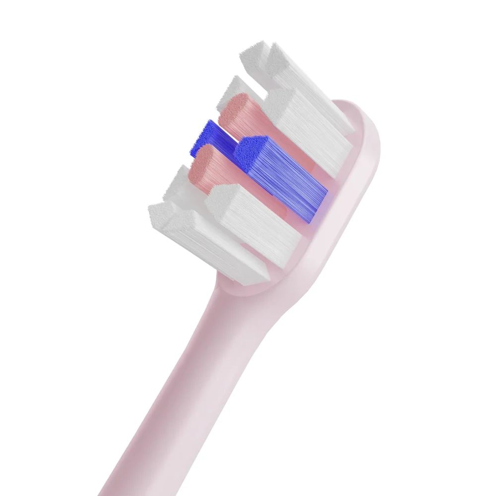 Close-up of Grin Teeth ET 3A minimalist electric toothbrush bristle tip, showing multi-level soft bristles in pink, white, and blue