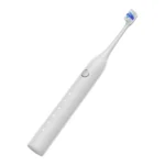 Grin Teeth ET 3B minimalist sonic toothbrush white model in tilted view, highlighting soft-touch surface and mode indicators