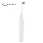 Grin Teeth ET 6B electric rotating toothbrush in white, quiet motor design with slim matte-finish back view