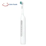 Grin Teeth ET 6B electric rotating toothbrush in white, side view showing quiet motor design and ergonomic handle