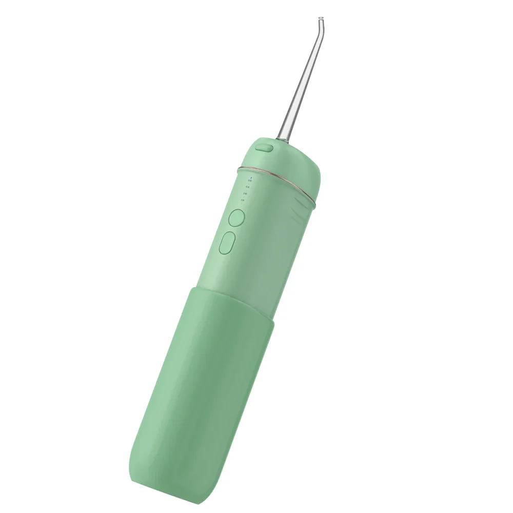 Angled view of Grin Teeth WF 3B portable oral irrigator in mint green, highlighting control buttons and nozzle