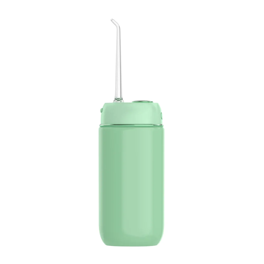 Rear side view of Grin Teeth WF 3B portable oral irrigator in mint green with ergonomic nozzle design