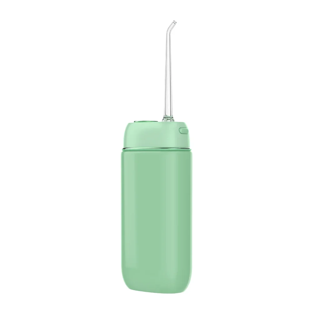 Side profile of Grin Teeth WF 3B portable oral irrigator in mint green, featuring ergonomic nozzle design