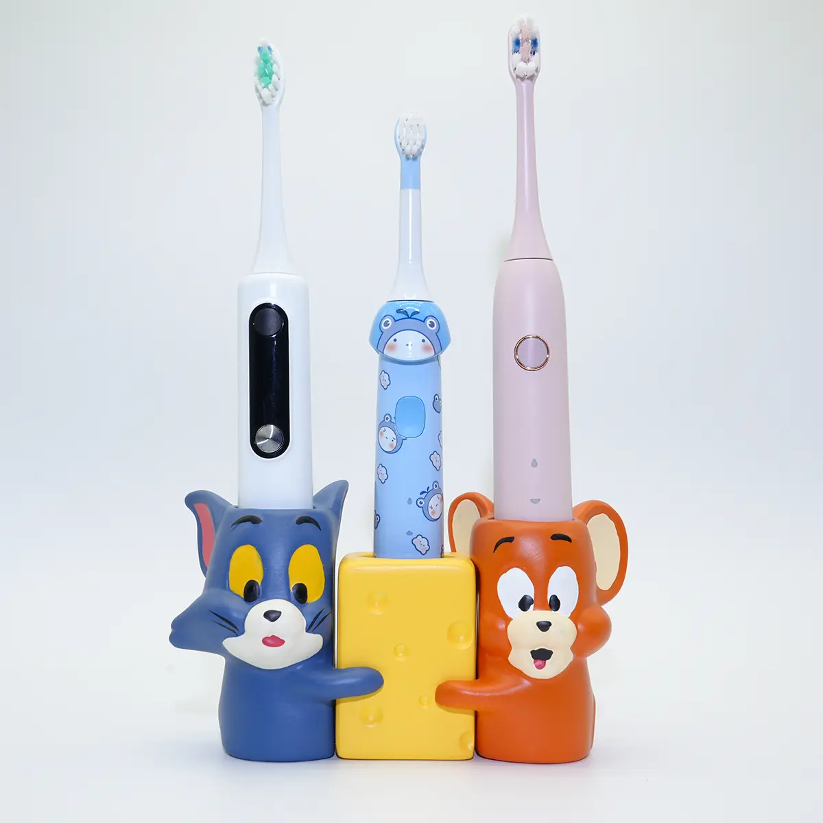 Tom and Jerry ceramic toothbrush holder with three electric toothbrushes, ideal for family bathroom organization