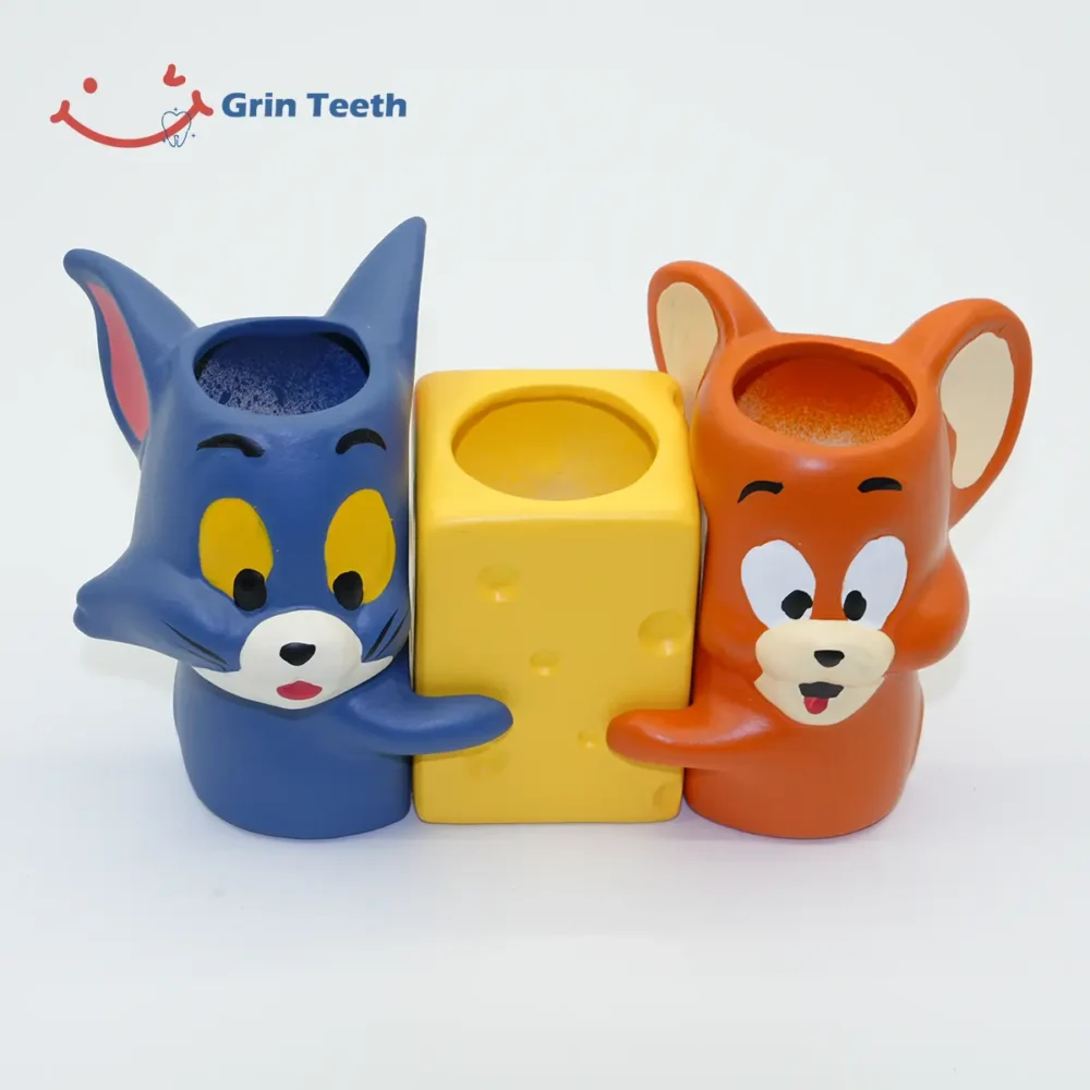 Top view of Tom and Jerry ceramic toothbrush holder showing open compartments for toothbrushes and toothpaste