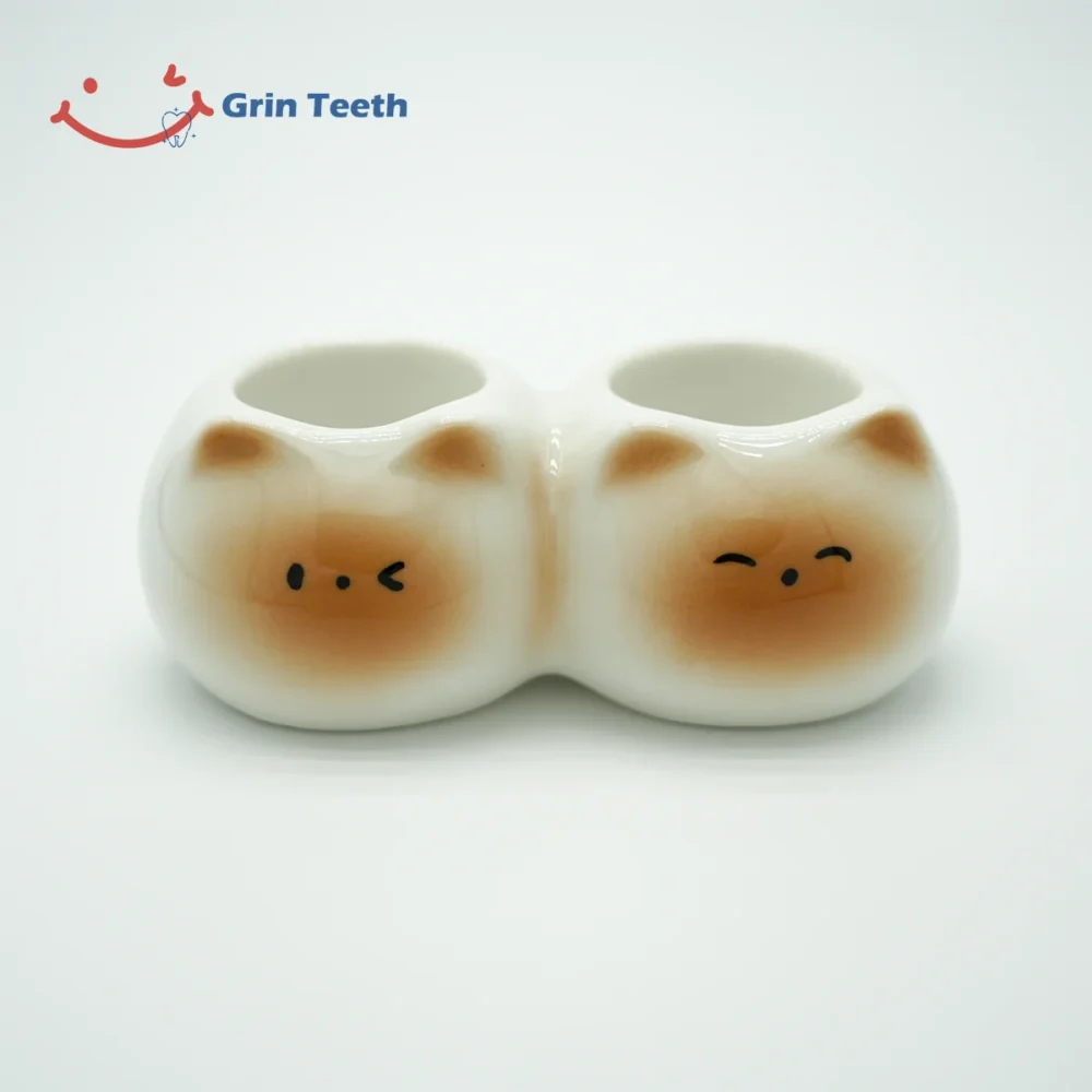 Ceramic cute toothbrush holder with 2 slots and cat face design