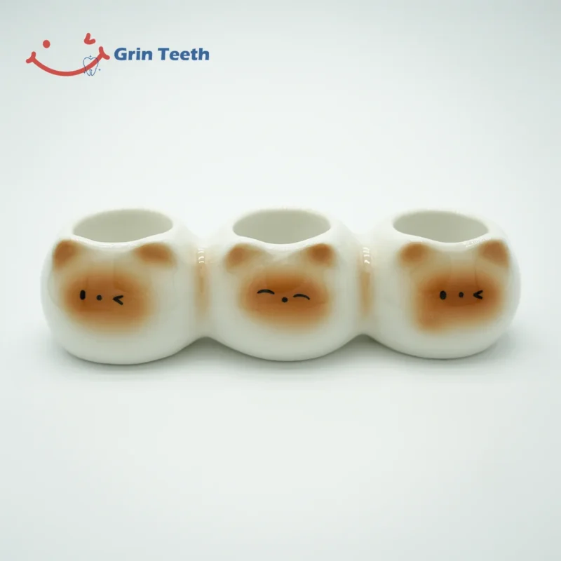 Ceramic cute toothbrush holder with 3 slots and cat face design