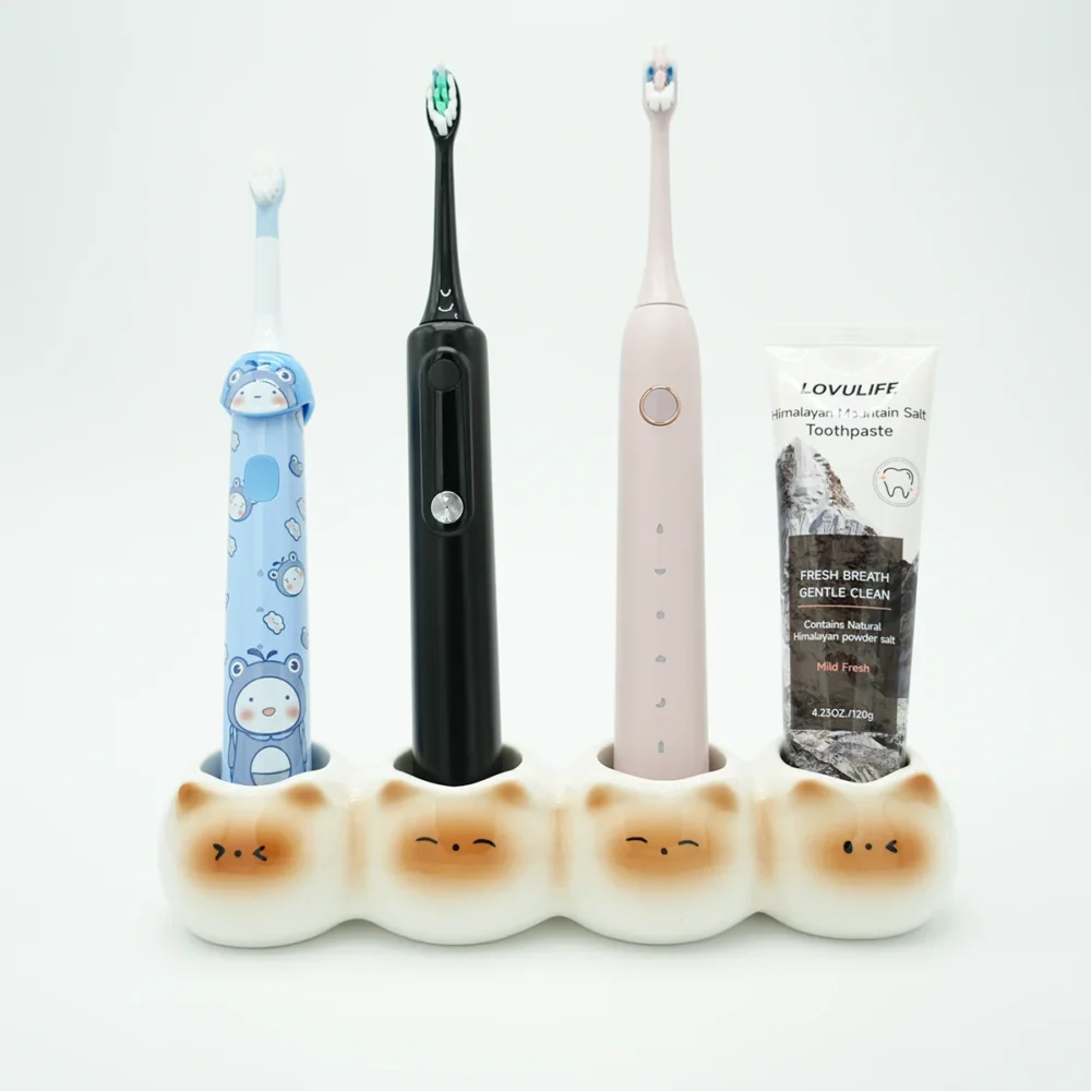Ceramic cute toothbrush holder with 4 slots holding 3 brushes and 1 toothpaste