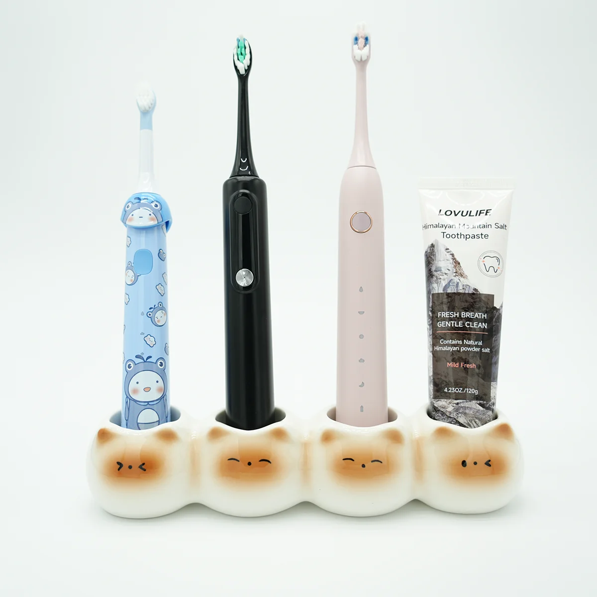 Ceramic cute toothbrush holder with 4 slots holding 3 brushes and 1 toothpaste