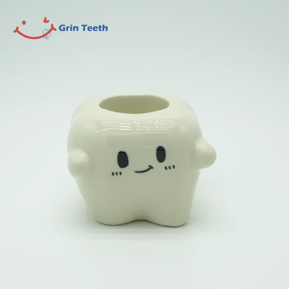 Front view of single-slot tooth-shaped ceramic electric toothbrush holder