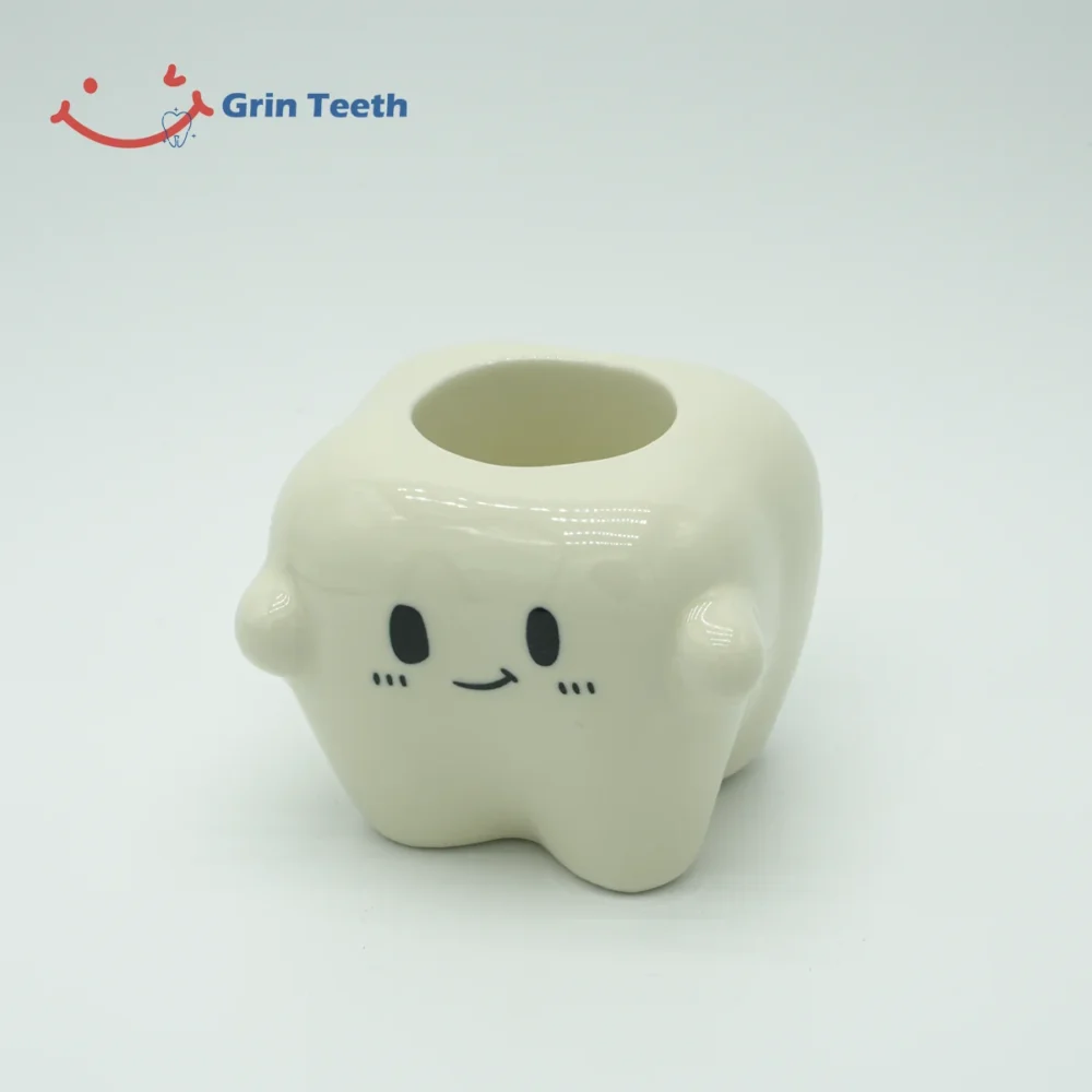 Tooth-shaped ceramic electric toothbrush holder with 1 slot, front view