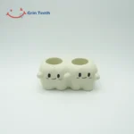 Back view of tooth-shaped ceramic electric toothbrush holder with 2 slots
