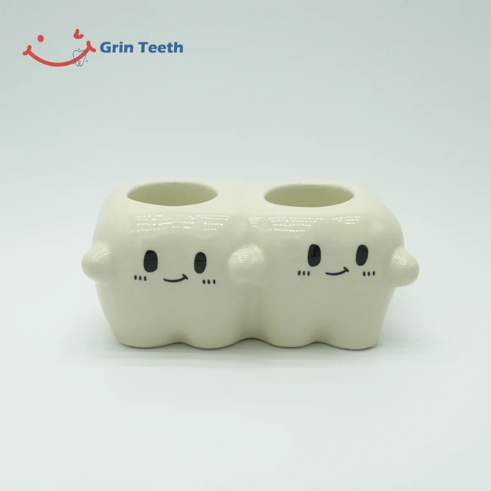 Cute ceramic electric toothbrush holder with 2 slots in a tooth-shaped design
