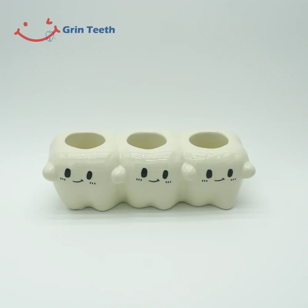 Ceramic electric toothbrush holder with 3 slots in tooth-shaped design
