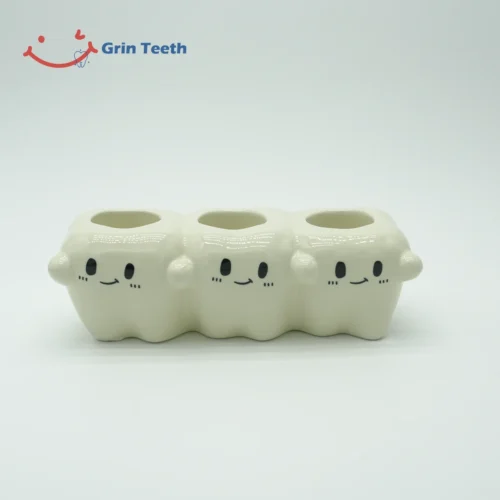 Tooth-shaped ceramic electric toothbrush holder with 3 slots