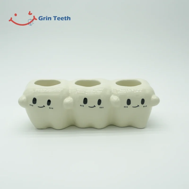 Tooth-shaped ceramic electric toothbrush holder with 3 slots