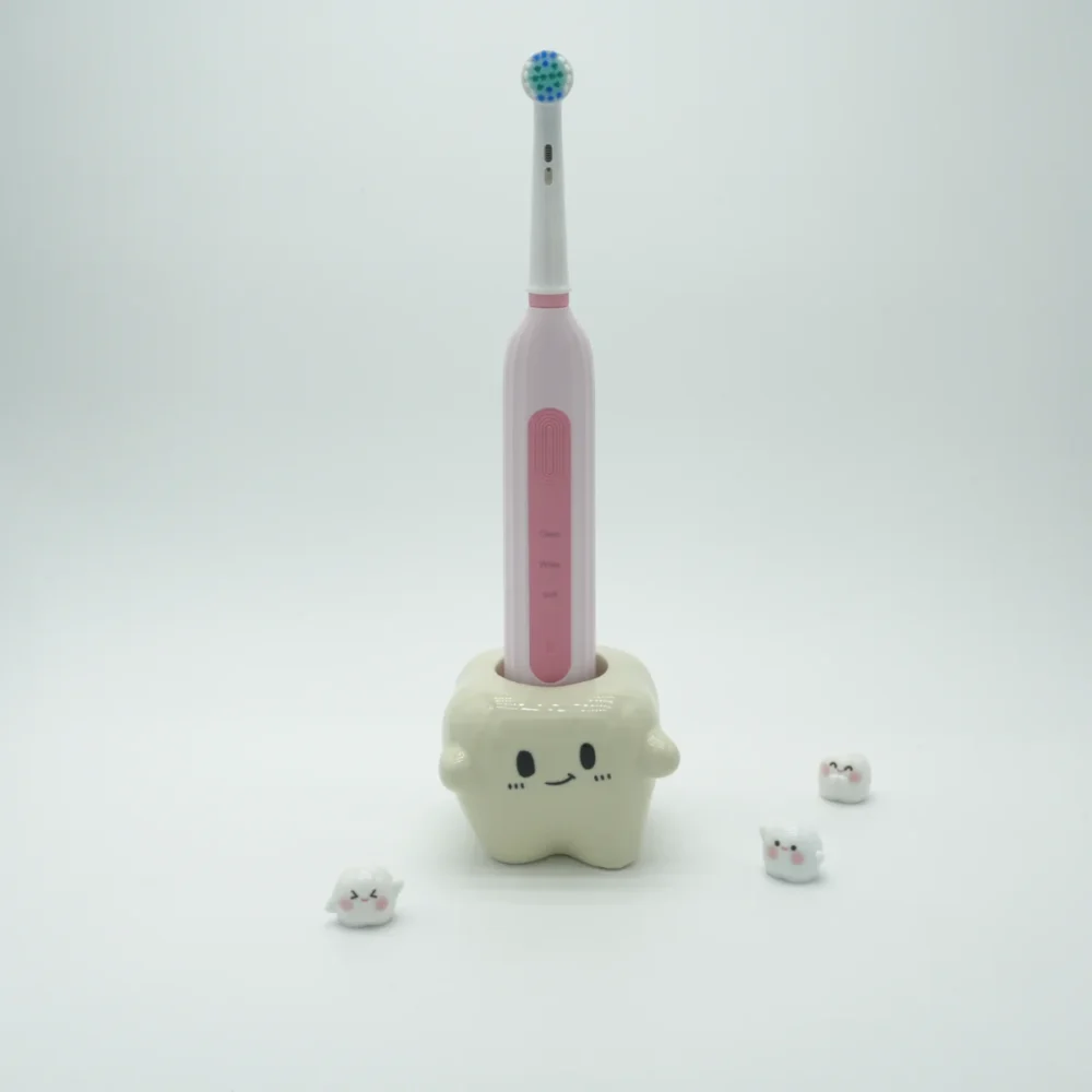 Single-slot ceramic toothbrush holder shaped like a tooth with one electric toothbrush