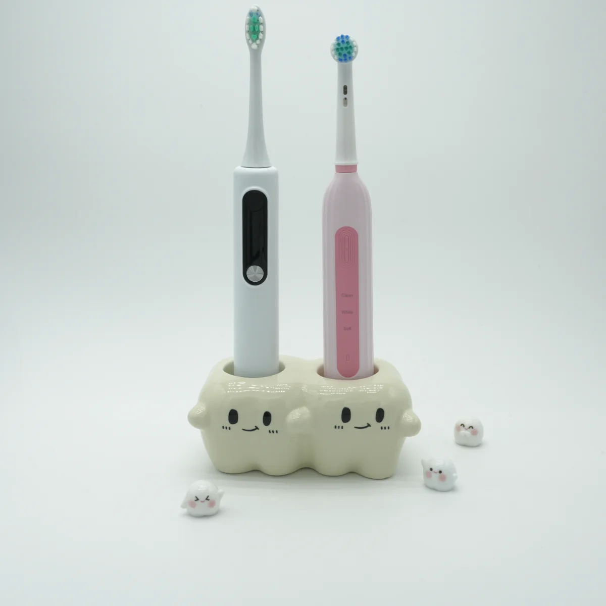 Tooth-inspired ceramic electric toothbrush holder with 2 electric toothbrushes inserted