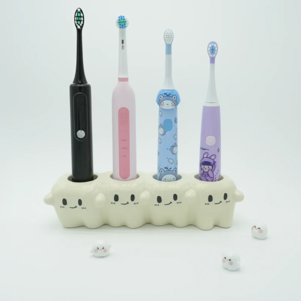 Tooth-inspired ceramic electric toothbrush holder organizing 4 colorful toothbrushes