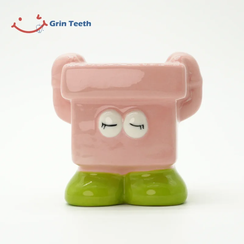 Pink children’s toothbrush holder with playful design to inspire kids’ daily brushing joy.