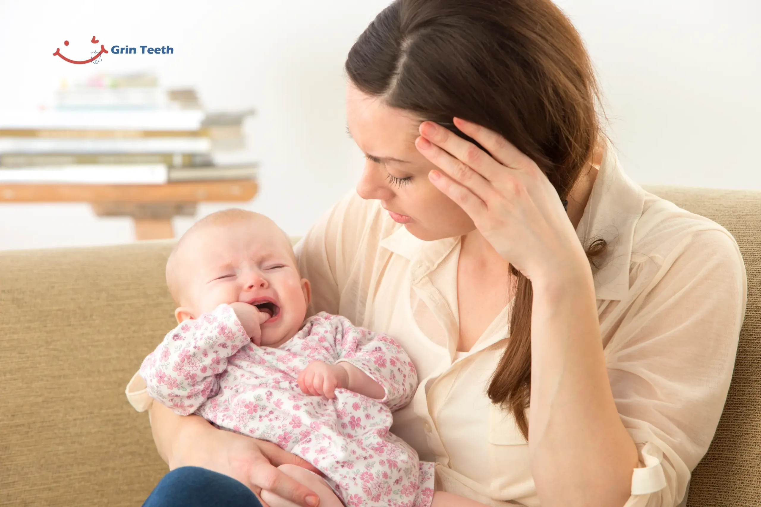 Do Babies Sleep More When Teething Fussy Nights Explained scaled Mother holding a crying baby chewing fingers—Do Babies Sleep More When Teething? Image reflects fussiness that can disrupt nighttime sleep.