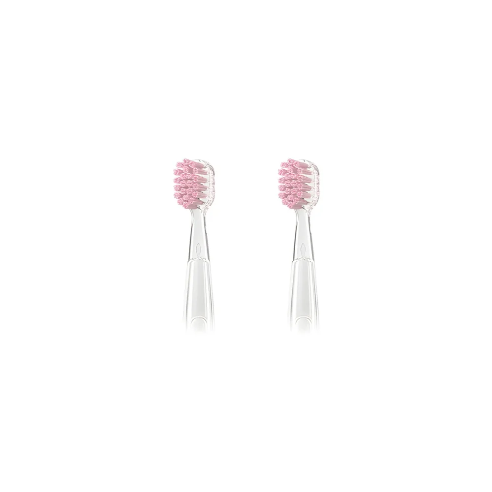 Two pink Grin Teeth ET 8 toothbrush heads with soft bristles