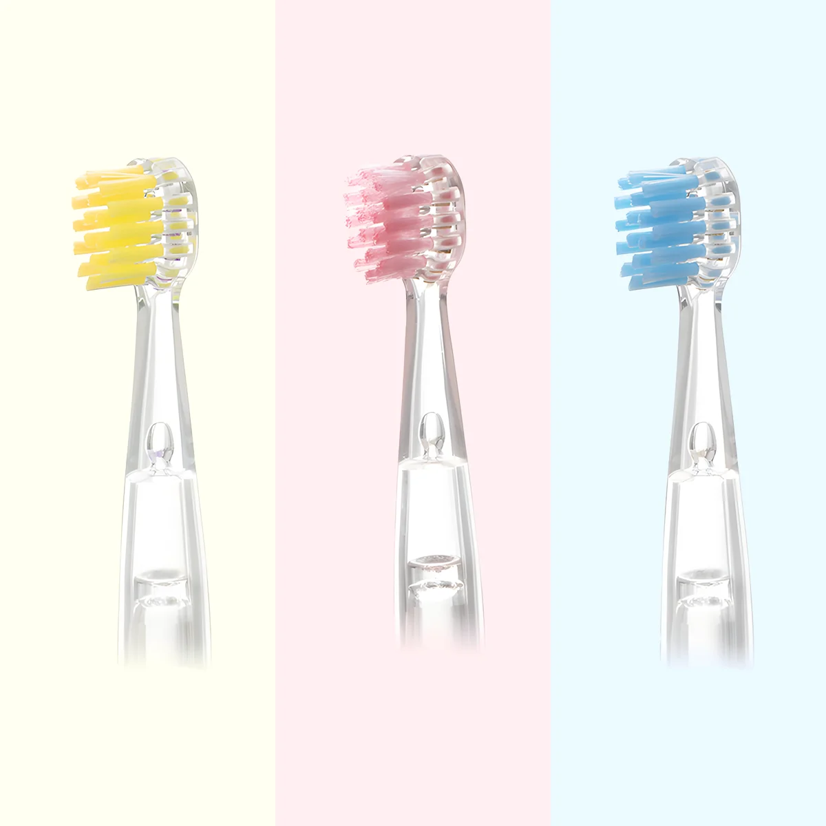 Three colors of Grin Teeth ET 8 toothbrush heads with soft bristles