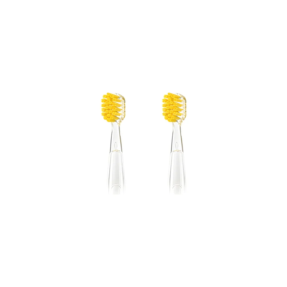 Two yellow Grin Teeth ET 8 toothbrush heads with soft bristles