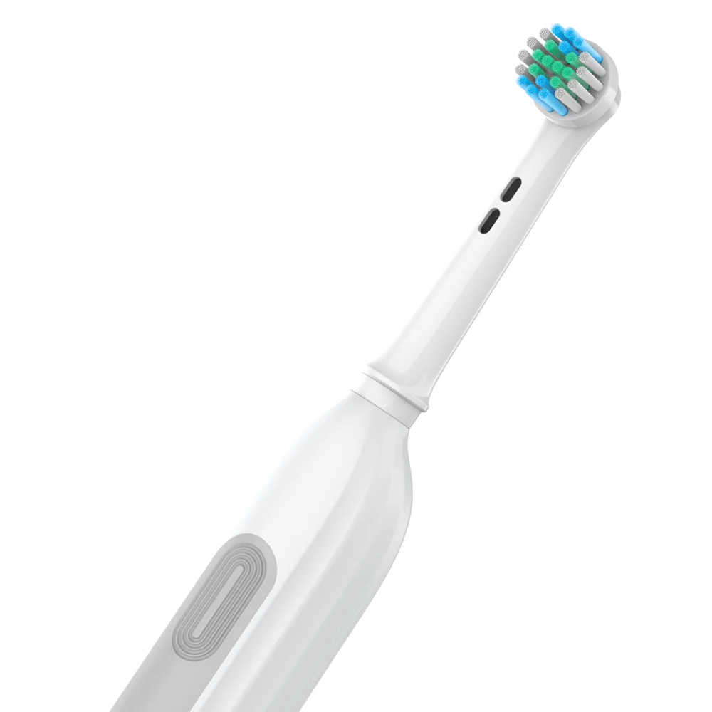 Angled close-up of Grin Teeth ET 6B electric rotating toothbrush, quiet operation and precision brush head